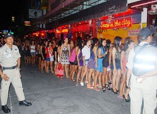 Bar workers are lined up on Soi 6 so that police can test them for drugs.